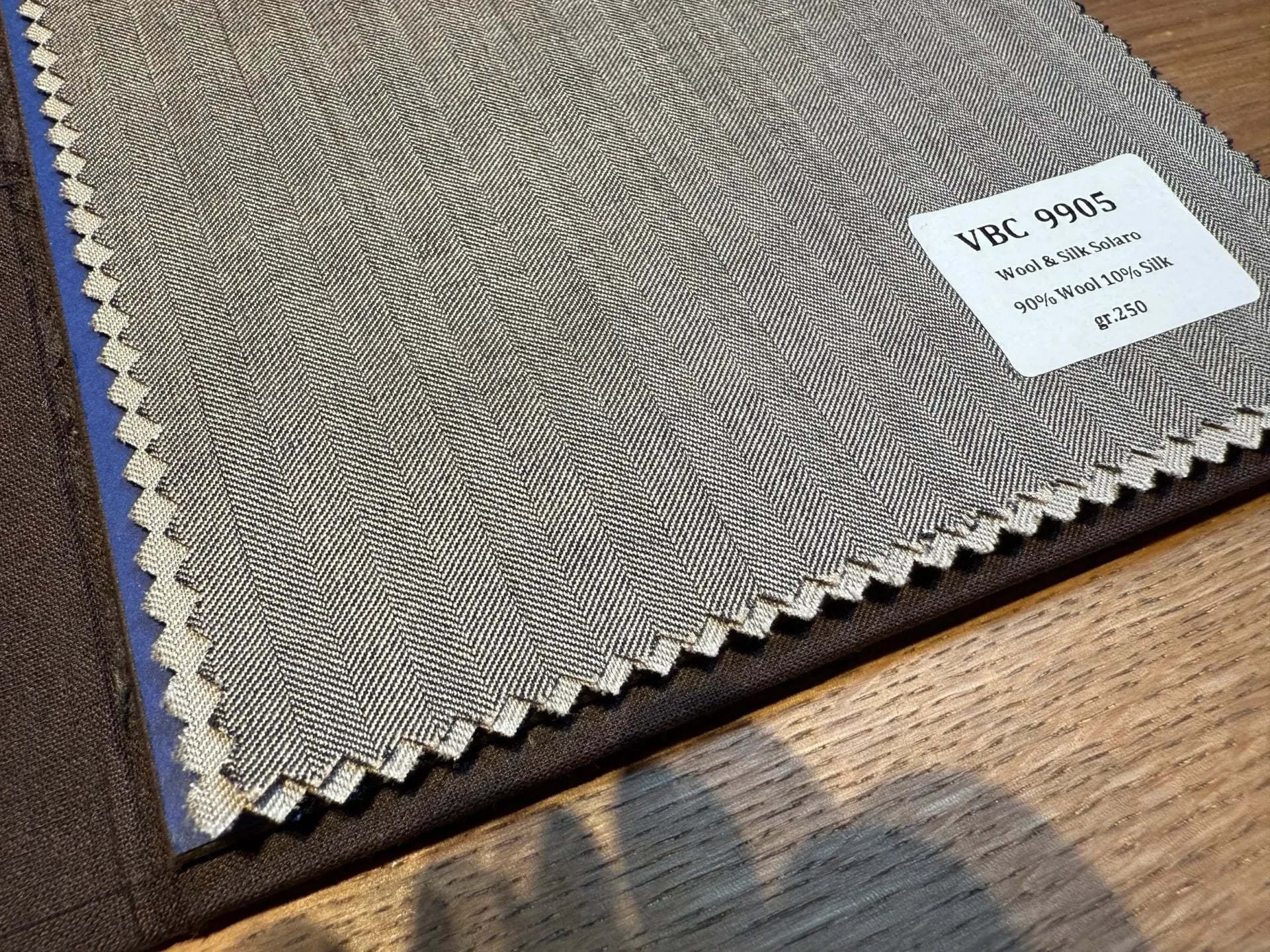 VBC 9905 Solaro wool-silk herringbone swatch with subtle grey-beige two-tone shimmer
