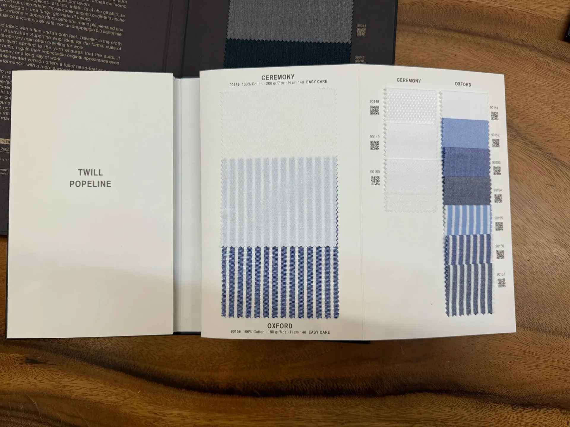 Open Zegna fabric book showing Ceremony and Oxford blue striped shirting swatches by category