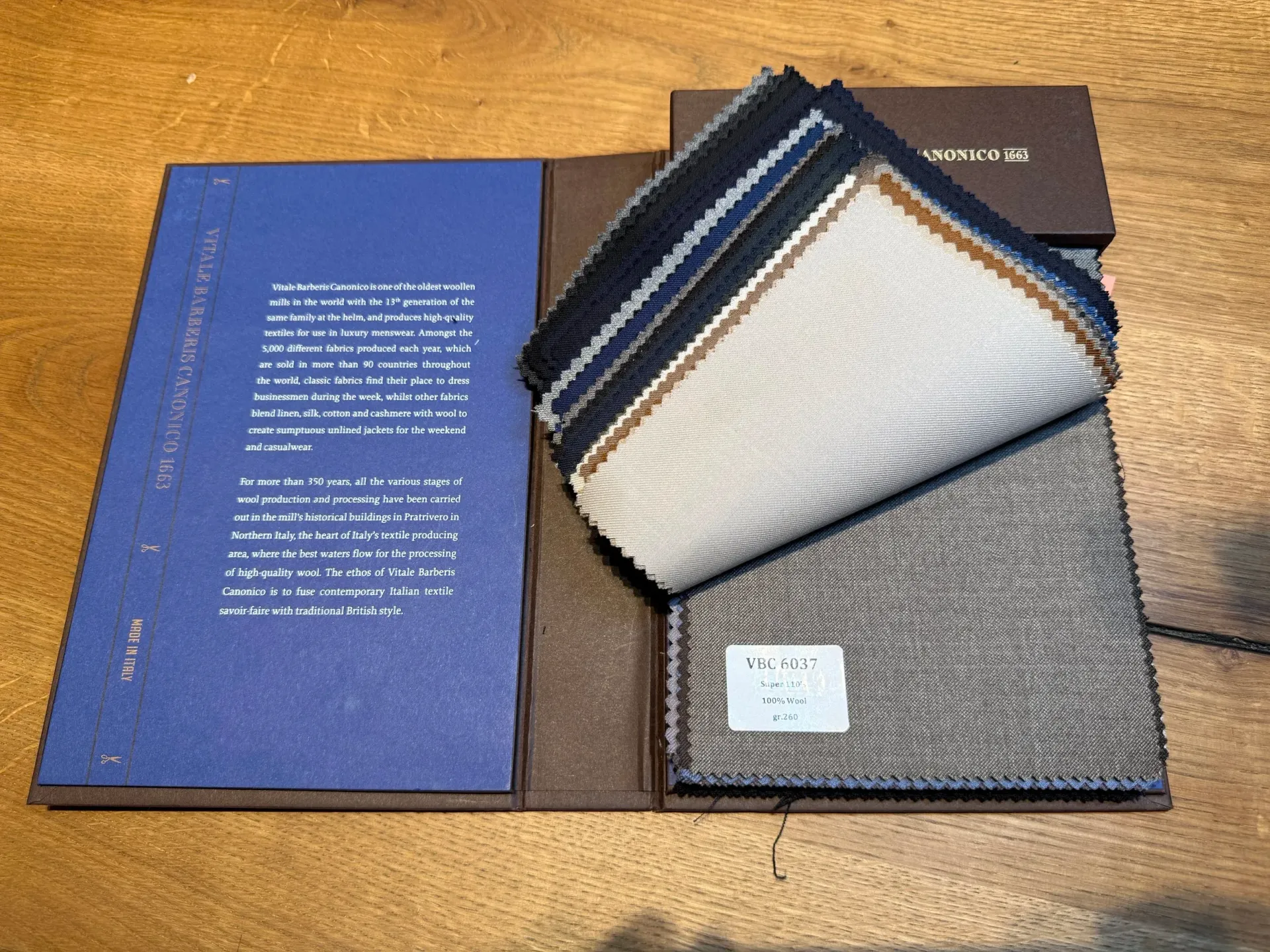 VBC Super 110s swatch book, navy, blue, cream and grey wool swatches fanned out