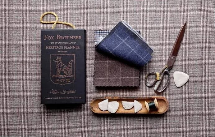 Fox Brothers Heritage Flannel box with grey and navy swatches, shears and chalk