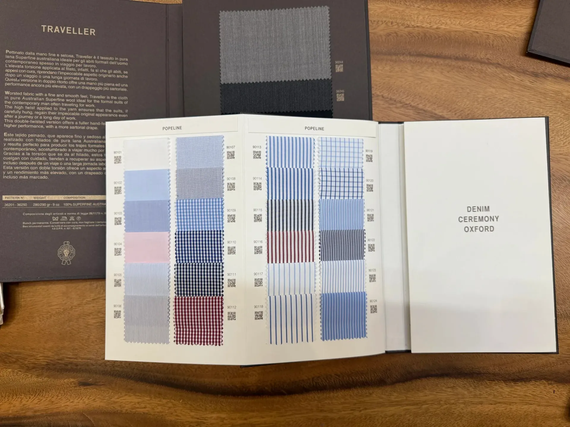 Zegna swatch book open to Popeline page with blue, red, and checked shirting fabrics