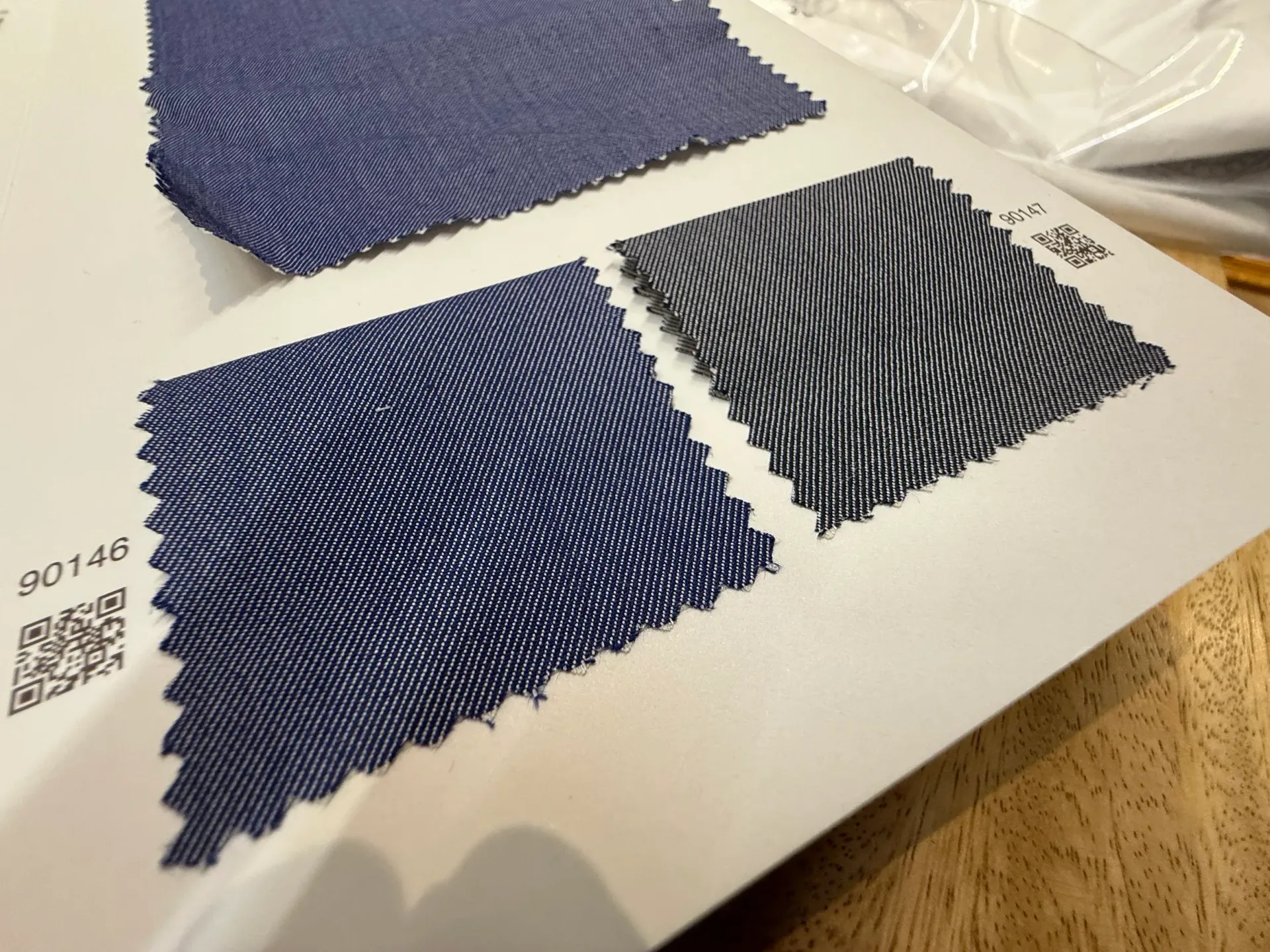 Zegna denim shirting swatches in indigo blue and charcoal grey twill weave