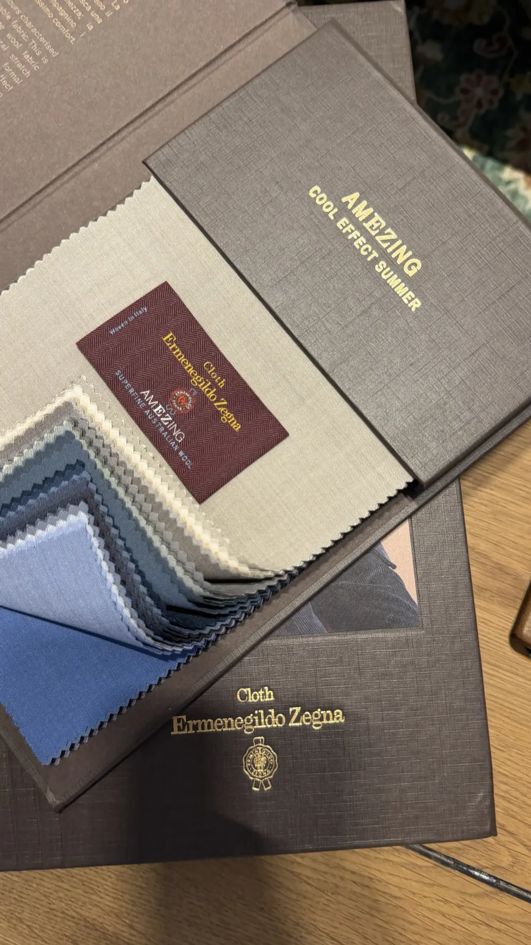 Light blue AmEZing Superfine wool swatch with the Ermenegildo Zegna article 19631 label, 100% Superfine Australian Wool