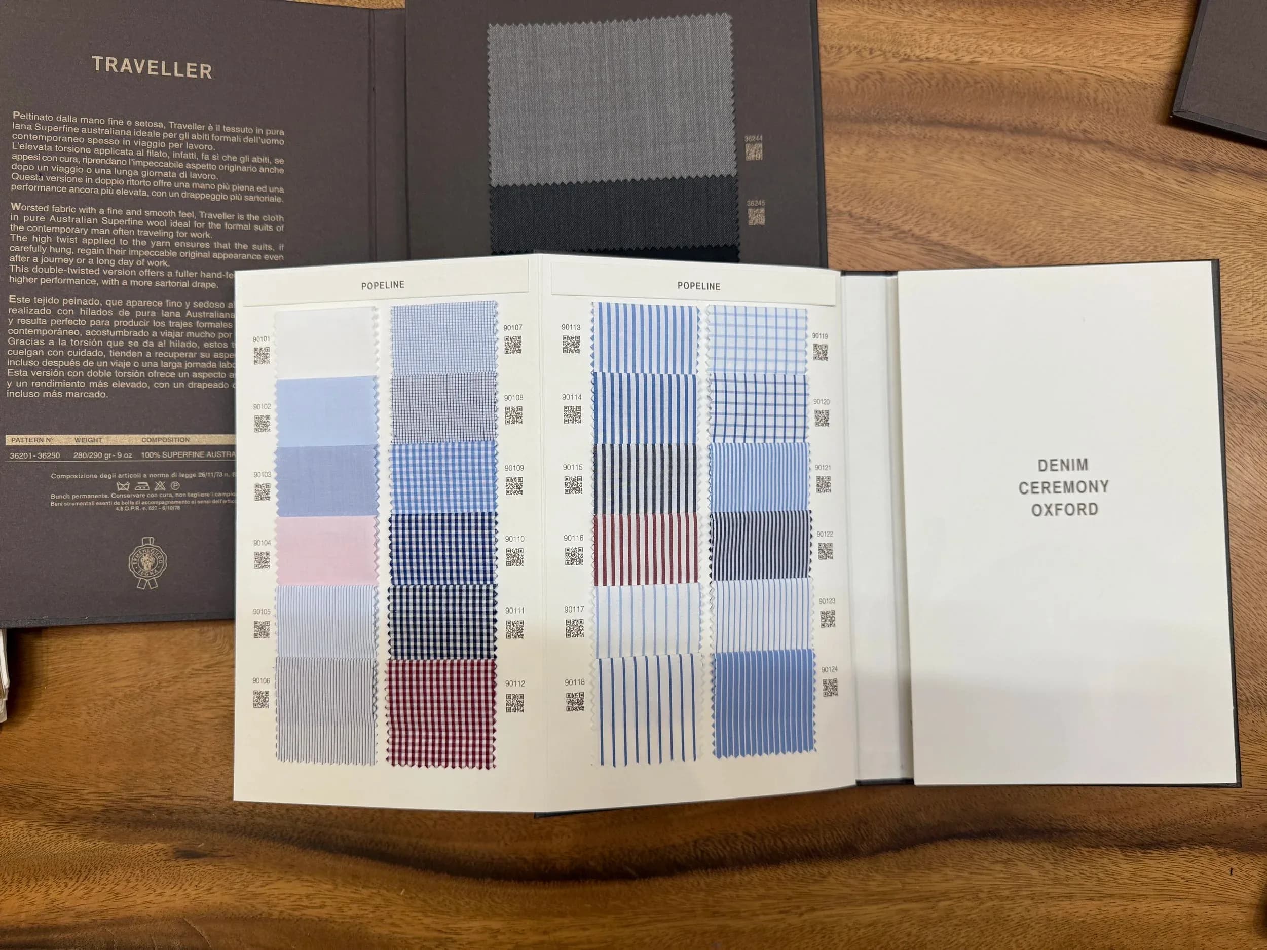 Zegna swatch book open to Popeline page with blue, red, and checked shirting fabrics
