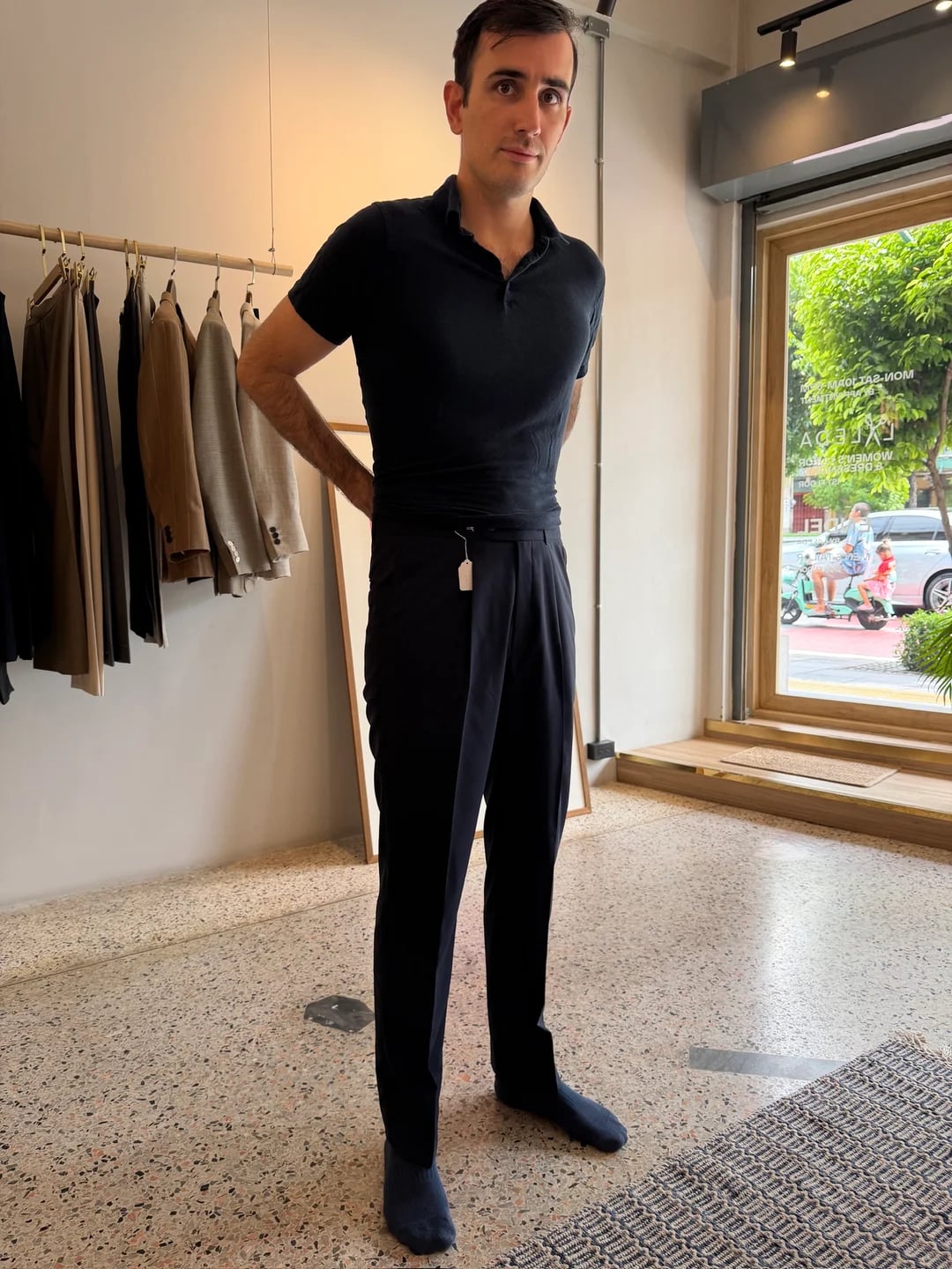 Client wearing VBC high-waisted forward-pleated bespoke trousers at Endel Tailor Bangkok